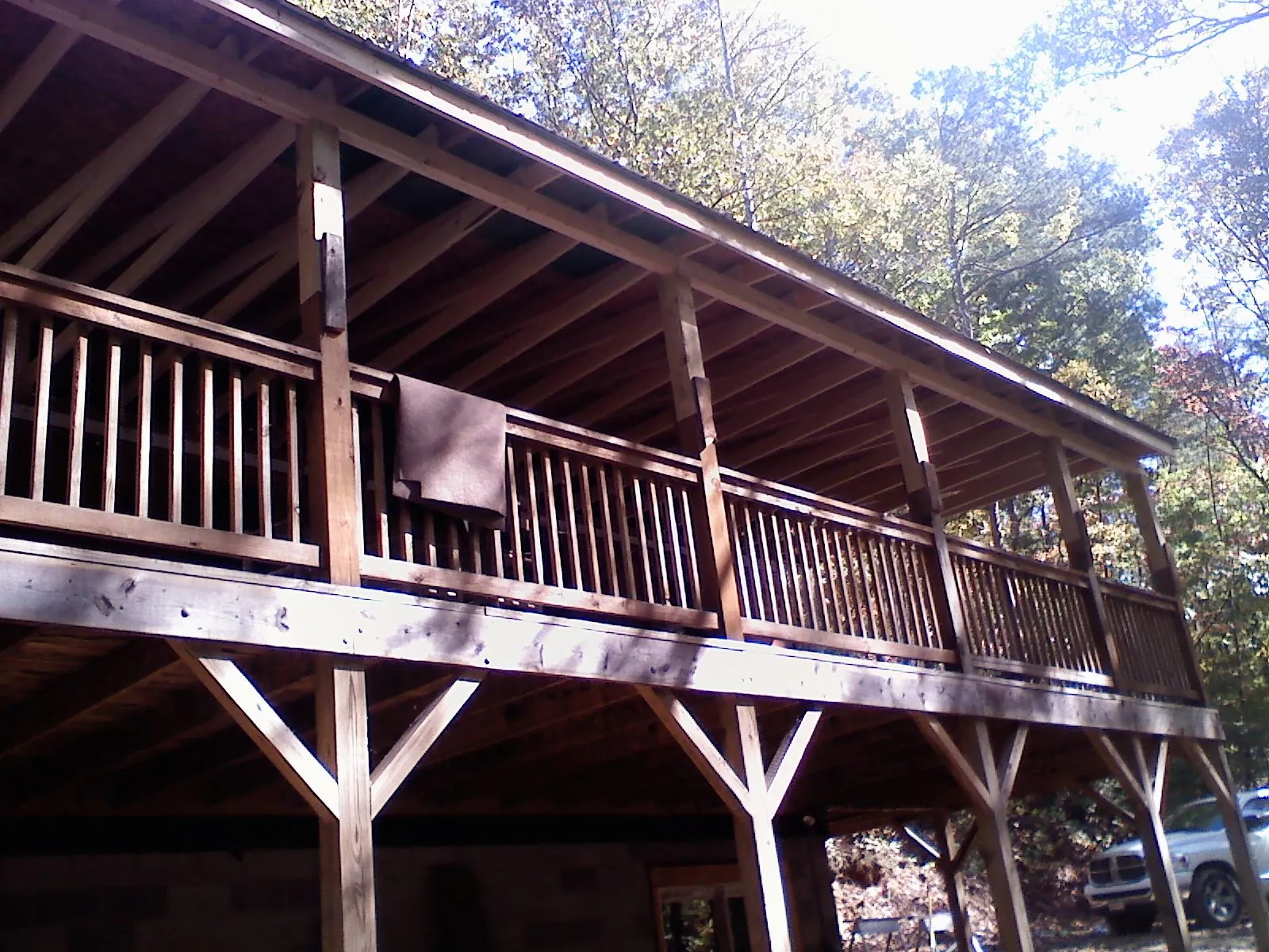 Timber framing under a new elevated porch and deck — Roof Leak Repair in Romney by Roofing Brothers